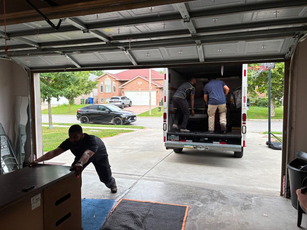 Professional movers loading a moving truck